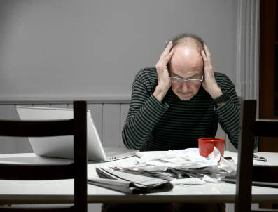 Debt Validation: What is proper validation? Man at desk.
